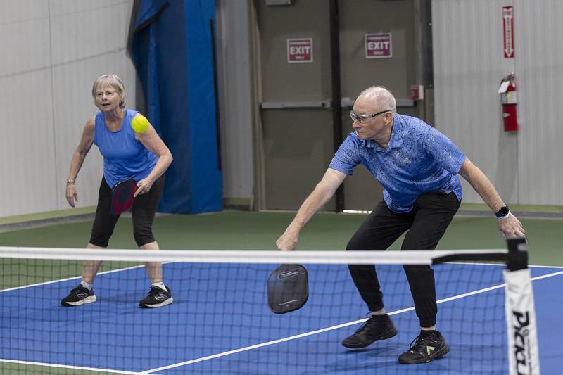 Pickleball instructors Janet and Jim Fisher help teach St. Anne’s students how to play the game Wednesday, Sept. 17, 2025, at Westwood.