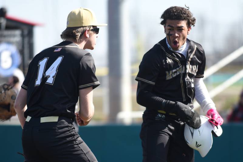 Bishop McNamara's Gavin Jones, right, is congrulated by Callaghan O'Connor after scoring a run during a game against Bradley-Bourbonnais at 315 Sports Park in Bradley Saturday, March 28, 2026.