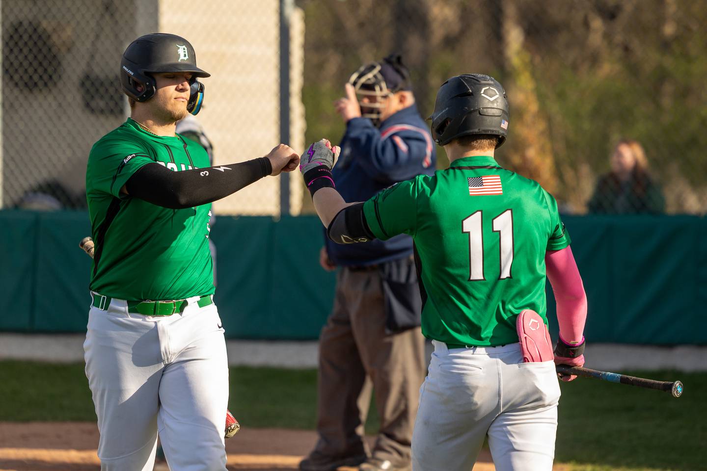 (left) Luke Gallet (3) of Dwight fist bumps teammate (right) Ryan Bumpous (11) on Tuesday, April 15, 2025 at St. Bede Academy in Peru.
