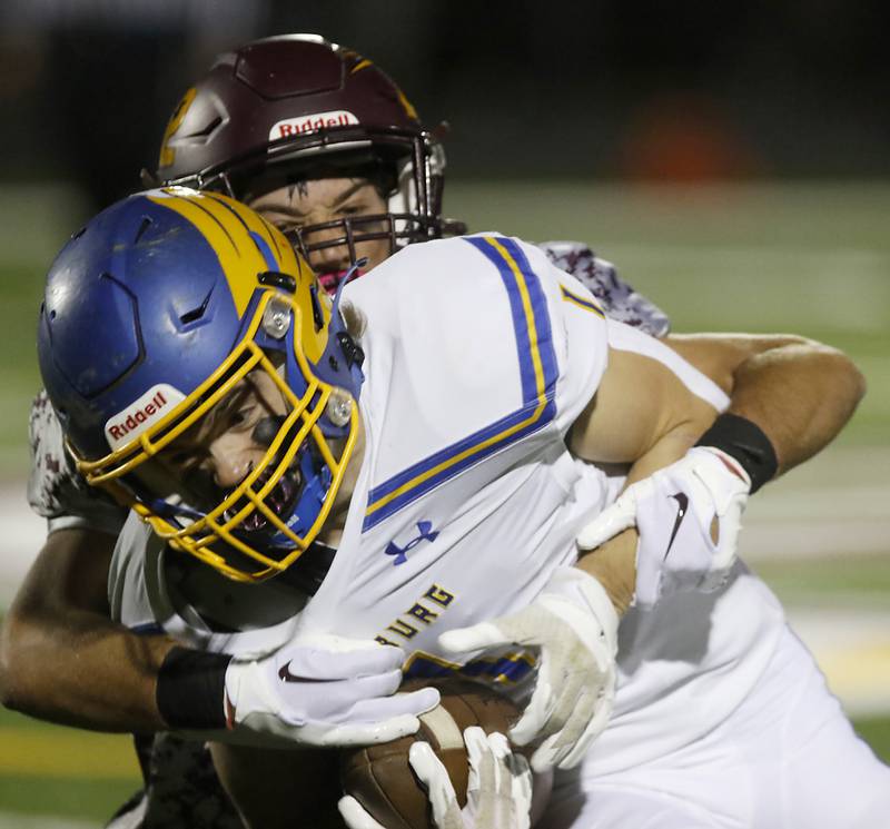 Richmond-Burton's Nick Falasca tackles Johnsburg's Jake Metze during a Kishwaukee River Conference football game Friday, Oct. 7, 2022, between Richmond-Burton and Johnsburg at Richmond-Burton Community High School in Richmond.