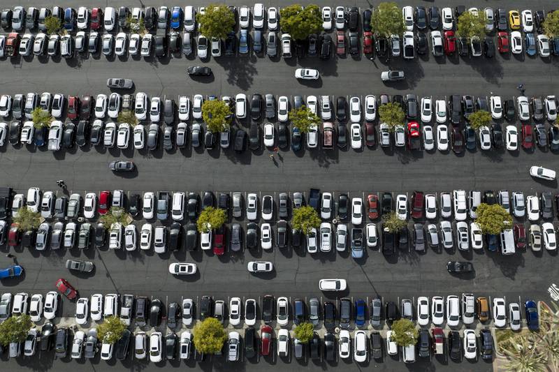 FILE - In this photo taken by a drone, motorists look for an open space to park in the parking lot of Citadel Outlets in Commerce, Calif., Monday, Nov. 21, 2022. The Federal Reserve is set to raise its benchmark short-term rate on Wednesday, Dec. 14, for a seventh time this year, though by a smaller amount than it has recently. (AP Photo/Jae C. Hong, File)