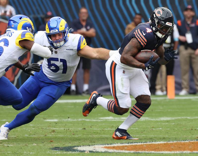 Chicago Bears running back D'Andre Swift avoids the tackle of Los Angeles Rams linebacker Troy Reeder during their game Sunday, Sept. 29, 2024, at Soldier Field in Chicago.