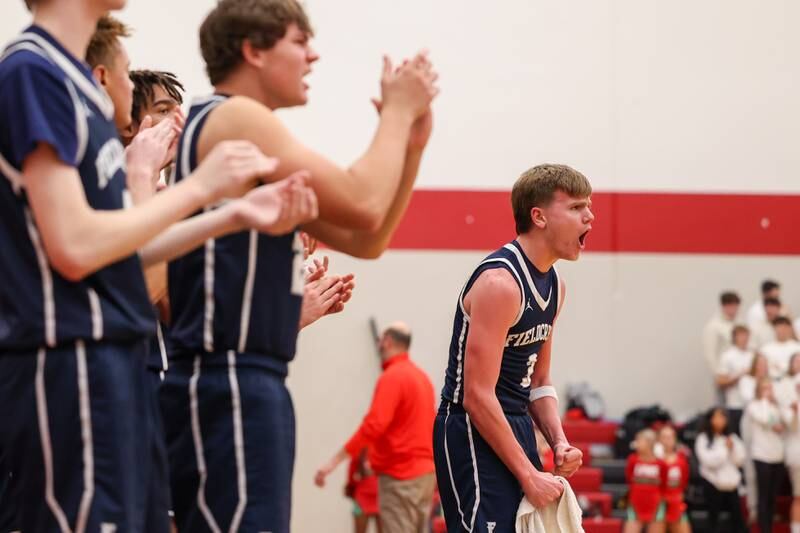 Fieldcrest players express excitement after scoring on Saturday, December 14, 2024 at Hall High School in Spring Valley.