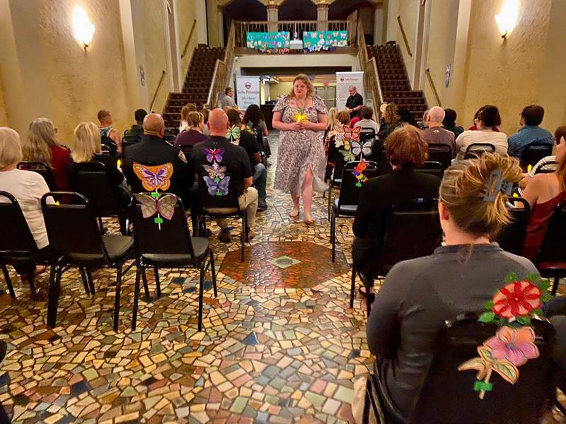Participants held candles during a vigil at the annual Safe Passage Domestic Violence Candlelight Vigil and Survivor Speak-Out inside the Egyptian Theatre, 135 N. Second St. in downtown DeKalb on Monday, Oct. 2, 2023.