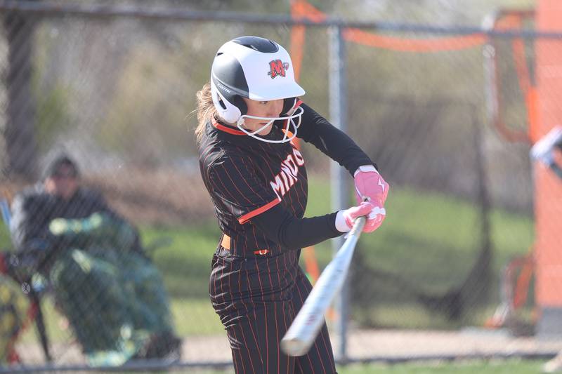 Minooka’s Cadence Murphy connects for a RBI single against Joliet Catholic on Tuesday, April 7, 2026 in Minooka.