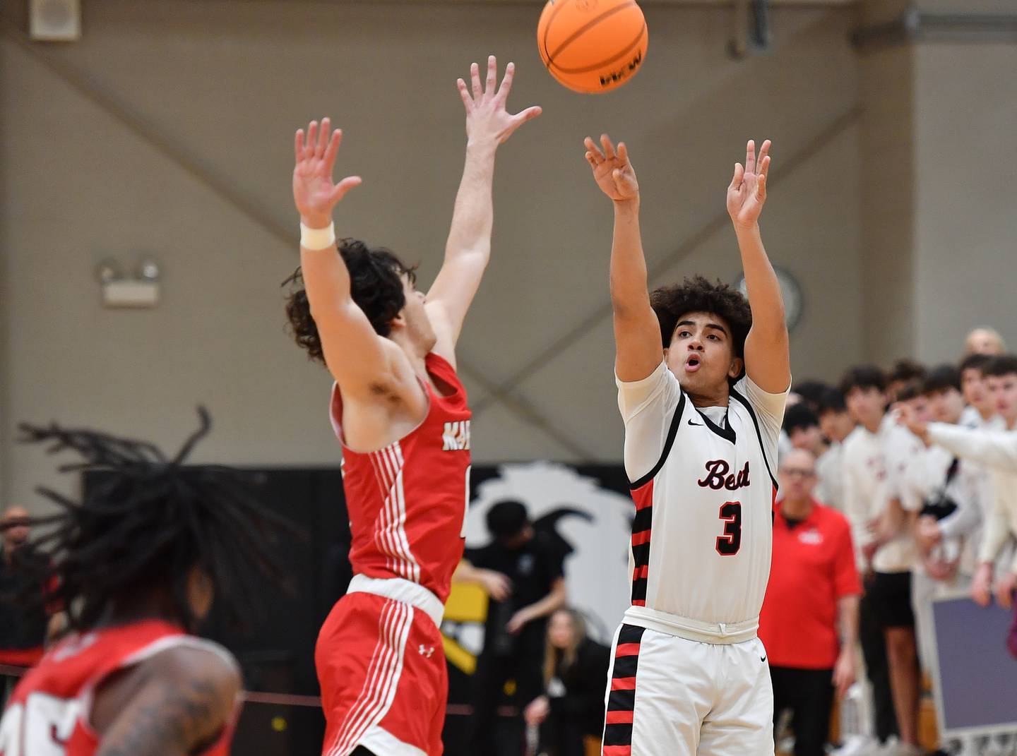 Benet’s Jayden Wright (3) shoots one of his three pointers during a game against Marist on Friday, Dec. 13, 2024 at Benet Academy in Lisle.