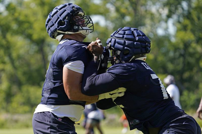 Chicago Bears offensive lineman Cody Whitehair, left, works with fellow lineman Shon Coleman during the team's training camp, Saturday, July 30, 2022, in Lake Forest.