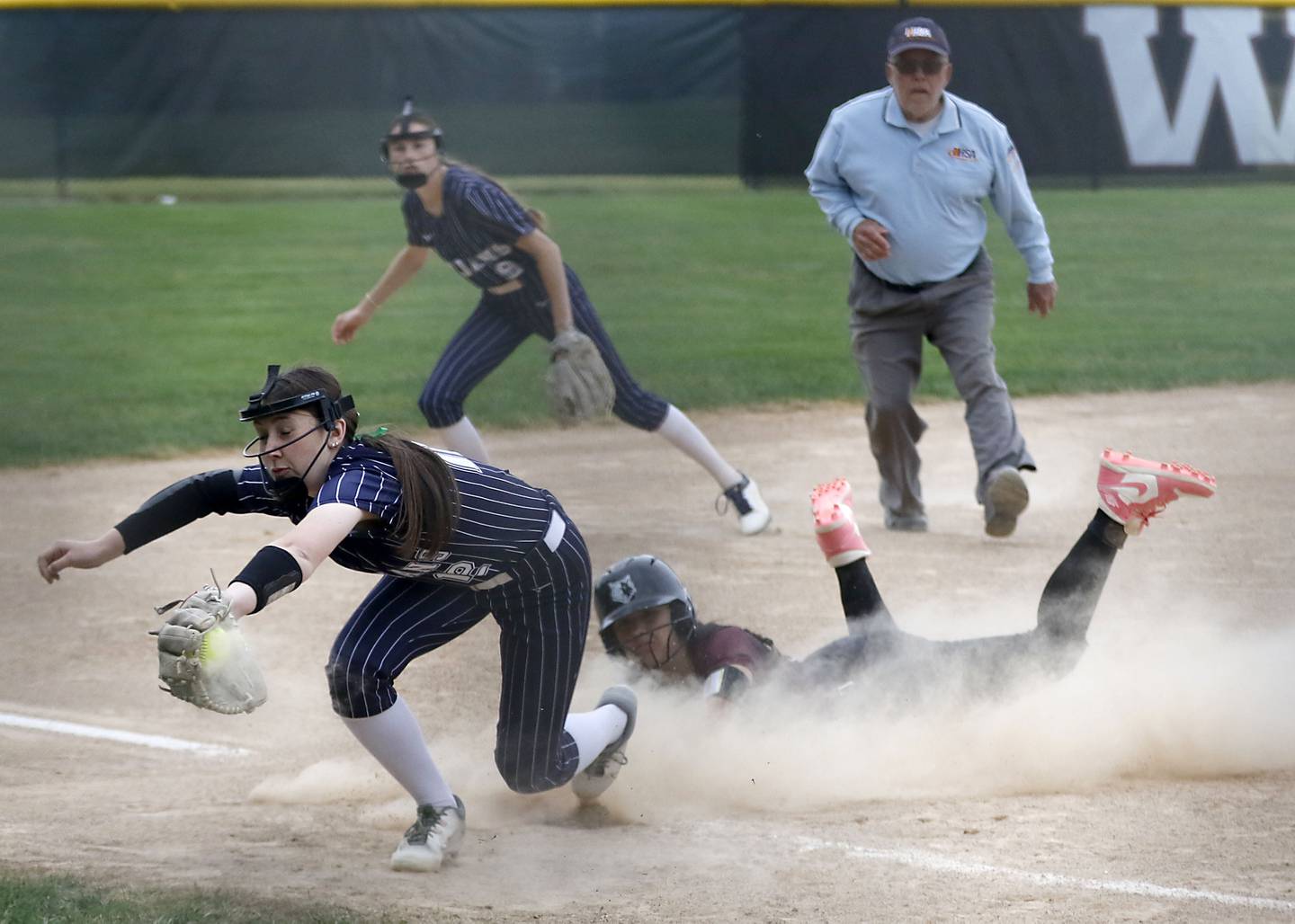 Cary-Grove’s Samantha Steiner fields the throw as Prairie Ridge's Olivia Swiderek slides into third base during the Class 3A Prairie Ridge Regional Championship softball game on Friday, May 22, 2026, at Prairie Ridge High School.