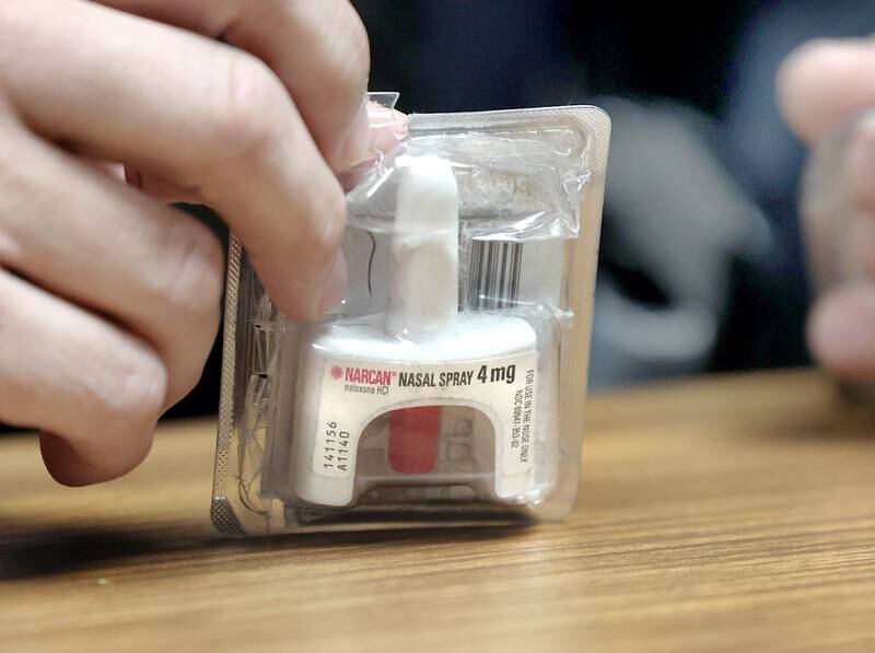 DeKalb County sheriff's deputy Doug Brouwer shows one of the Narcan sprays he carries at all times during a discussion about the opioid overdose treatment Friday, March 22, 2024, at the Sheriff’s Office in Sycamore.