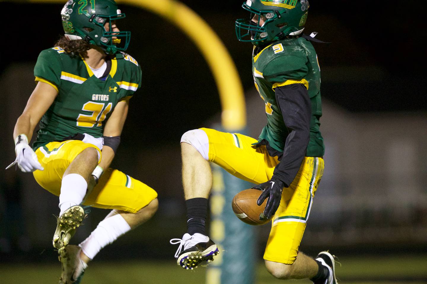 Crystal Lake South's Michael Prokos (21) and Colton Hess (3) celebrate a touchdown against Crystal Lake Central on Friday Sept.30,2022 in Crystal Lake.
