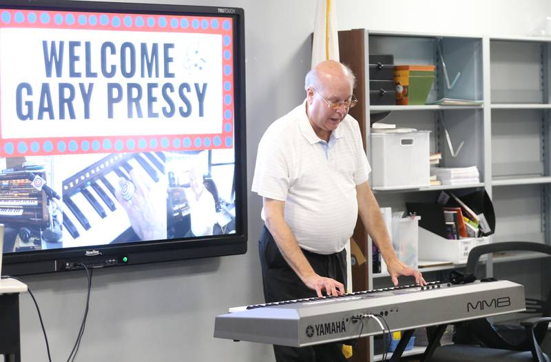 Retired organist Gary Pressy plays "Take Me Out To The Ballgame" to students at La Salle Lincoln Jr. High School in La Salle. Pressy was organist for the Chicago Cubs from 1987-2019. Pressy began playing the piano at age 5. He started his career with the Cubs on April 1, 1987. Pressy never missed a game in 33 years. "I've played 2,687 games and never missed one, said Pressy. Pressy held a question and answer session while visiting the school. He told the students "If you have a dream reach for the stars but keep your feet on the ground."