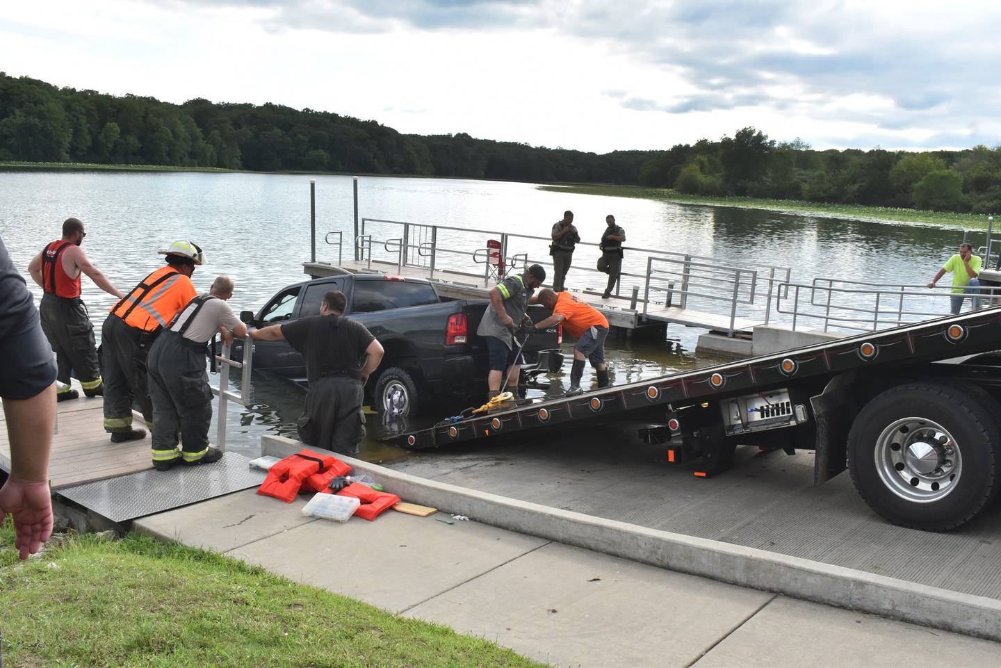 Morrison firefighters and others work to pull a truck, boat and trailer from the lake at Morrison Rockwood State Park near Morrison on Friday, July 18, 2025. No one was injured after the truck accidentally entered the lake at the boat ramp.