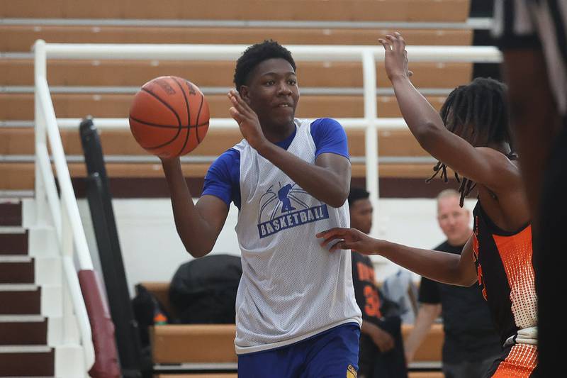 Joliet Central’s James Lee passes against DeKalb at the 37th Morris Boys Shootout on Tuesday, June 25, 2024.