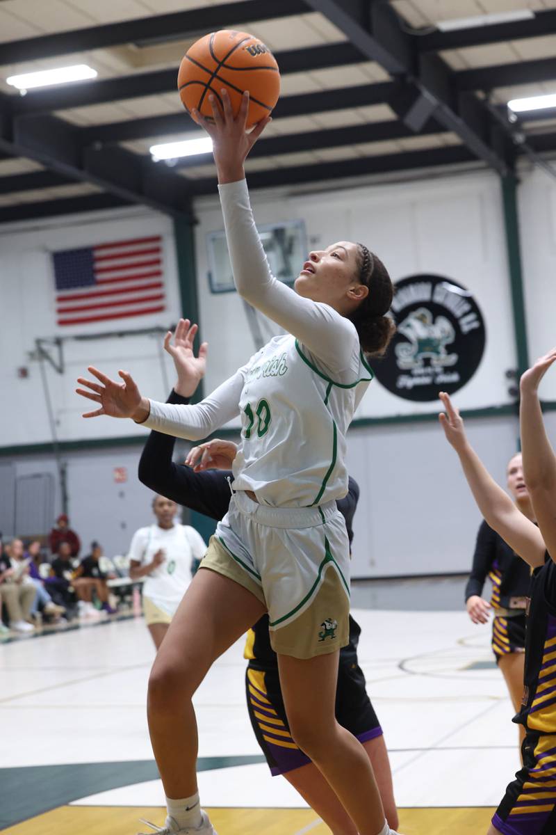 Bishop McNamara's Trinitee Thompson goes for a layup during the Fightin' Irish's 67-27 victory over Chicago Christian on Monday, Jan. 26, 2026.