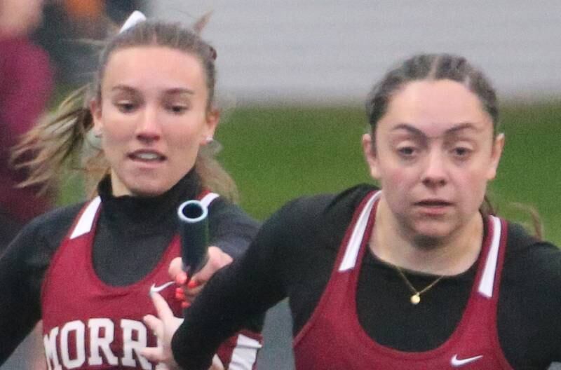 Morris's Makenzie Enger hands the baton to teammate Ella McDonnell in the 4x200 meter relay during the Class 2A girls track and field Sectional on Thursday, May 9, 2024 in Princeton.