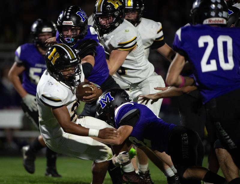 Herscher's Aleksander Draper, left, carries the ball and is brought down by Manteno's Carter Stell in a game on Friday, September 12, 2025.