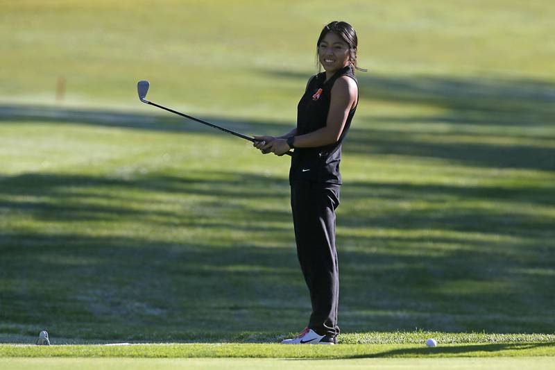 McHenry’s Jennifer Henry watches her chip shot on the 10th green during the Fox Valley Conference Girls Golf Tournament Wednesday, Sept. 25, 2024, at Crystal Woods Golf Club in Woodstock.
