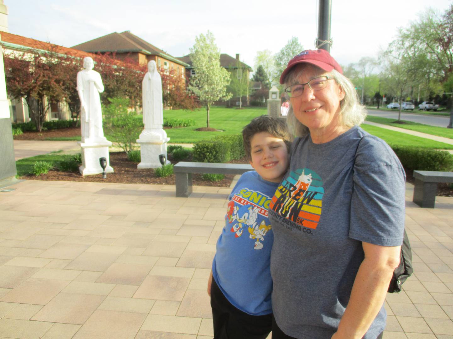 Kathryn Kolb walked to the Cathedral of St. Raymond Nonnatus with her nephew, Matthew, from her home in the neighborhood to pray for Pope Francis on Thursday. Joliet. April 24, 2025