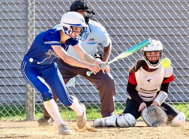 Princeton's Caroline Keutzer slaps the ball as Hall catcher Bernie Lawson sets up during the Tigresses' 15-0, four-inning victory on Thursday, May 7, 2026 in Princeton.
