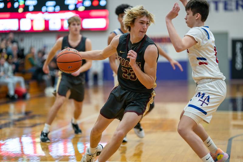 Morris’ Jonah Williams (33) plays the ball in the post against Marmion's Bradley Stratton (0) during the 59th Annual Plano Christmas Classic basketball tournament at Plano High School on Tuesday, Dec 27, 2022.