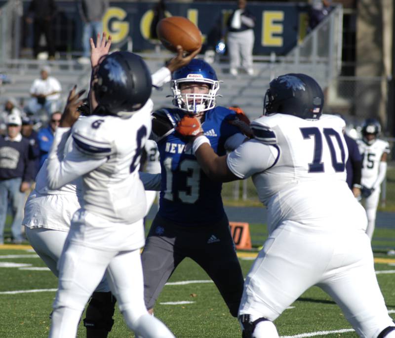 Newman's John Rowzee puts pressure on Chicago Hope QB D'Angelo Garner. Newman defeated Chicago Hope 50-22 in Class 1A 1st round football at Sterling High School on Saturday, November 2, 2024.