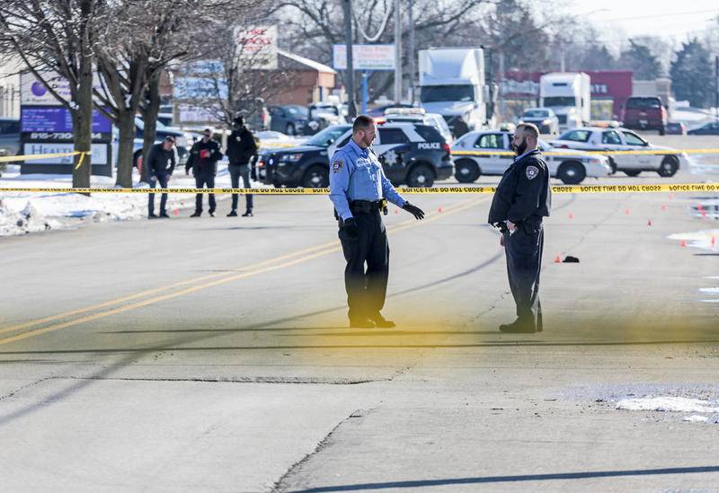 Police secure the scene of a shooting Friday, Feb. 7, 2020, along Republic Avenue in Joliet, Ill.