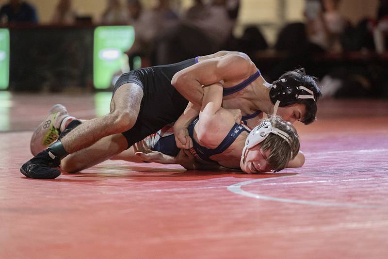 Dixon’s Riley Paredes takes on Morrison’s Landon Rubright at 113 pounds in the Class 1A wrestling sectionals at Oregon.