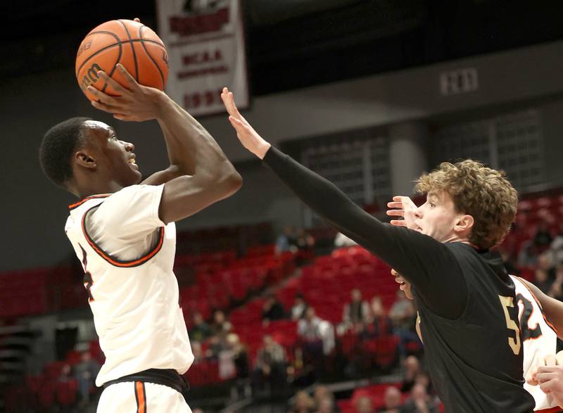 DeKalb’s Marquise Bolden shoots over Sycamore's Preston Picolotti Friday, Jan. 26, 2024, during the FNBO Challenge in the Convocation Center at Northern Illinois University.