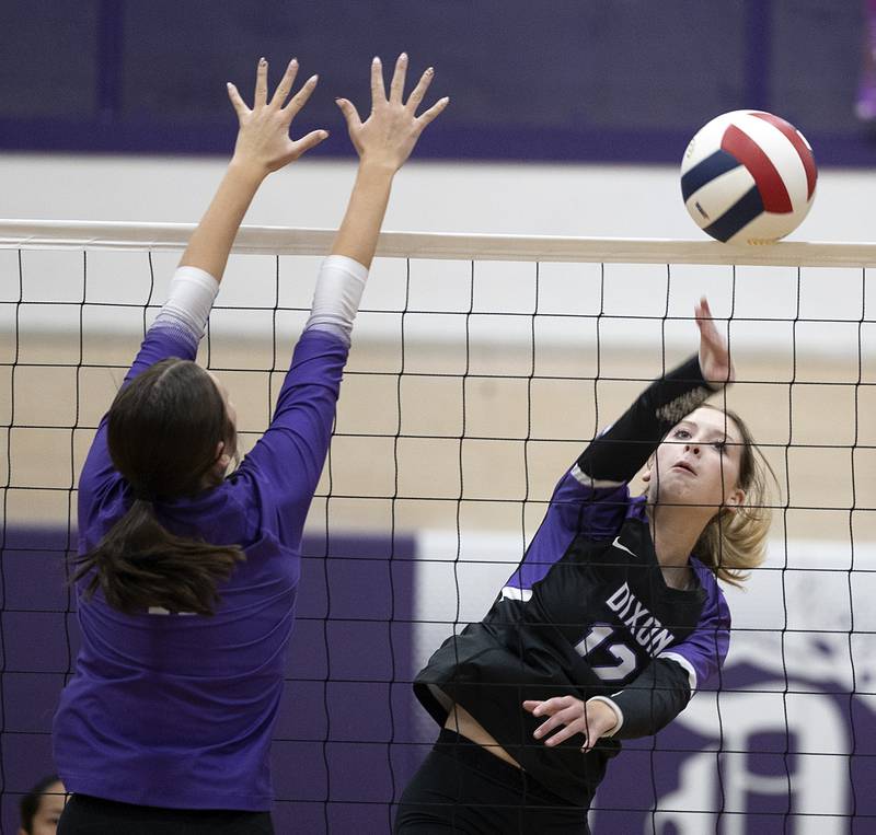 Dixon’s Isabelle Quackboerner hammers the ball against Rochelle Monday, Oct. 28, 2024, during regional play in Dixon.