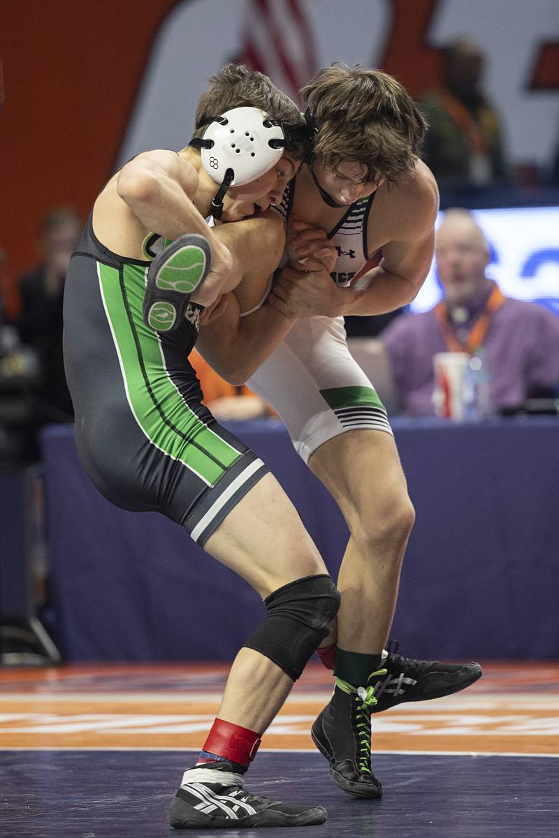 Grayslake Central’s Vince DeMarco works on the leg of Christian Corcoran of Providence Catholic in the 2A 113 pound class Saturday, Feb. 21, 2026, at the IHSA wrestling finals in Champaign.