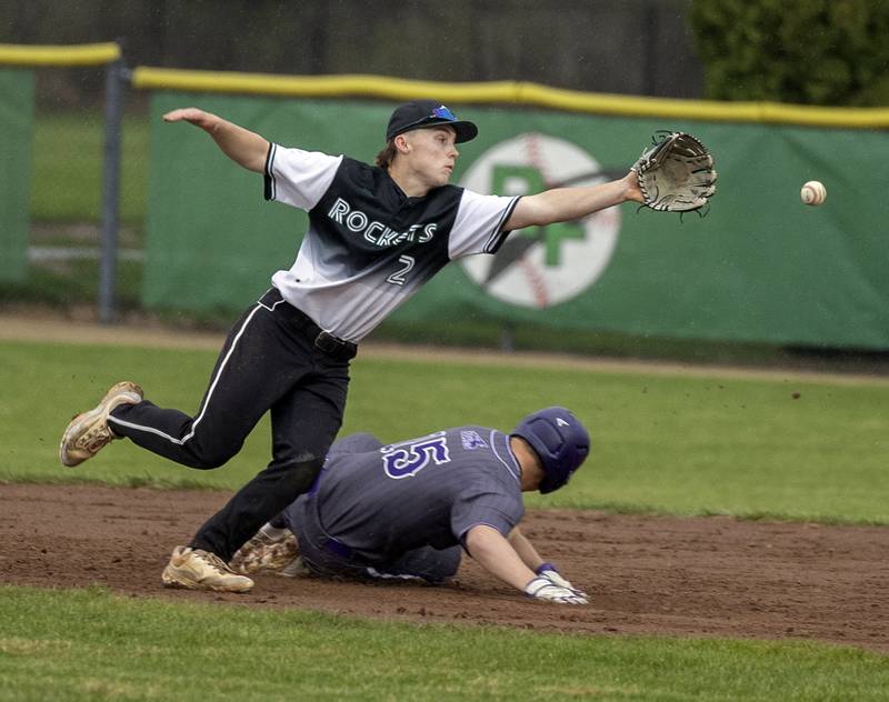 A throw sails by Rock Falls’ Ethan Mathews as Dixon’s Daniel Fordham steals second Thursday, April 9, 2026.