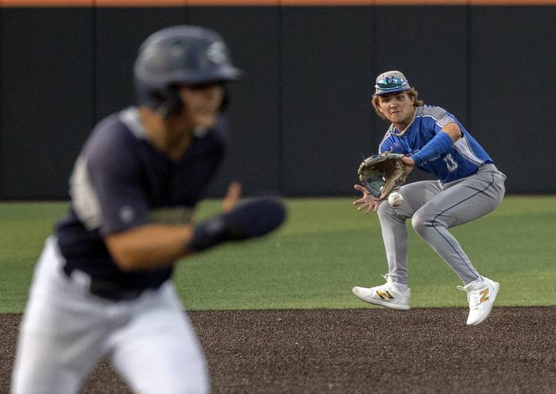 Newman’s Garet Wolfe makes a play at shortstop against Teutopolis Friday, June 6, 2025, during the Class 2A state semifinal at Illinois Field in Champaign.