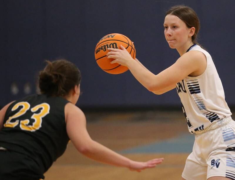 Bureau Valley's Lesleigh Maynard looks to pass the ball off as Riverdale's Jillian Murray defends during the Thanksgiving Tournament on Wednesday, Nov. 20, 2024 at Bureau Valley High School.
