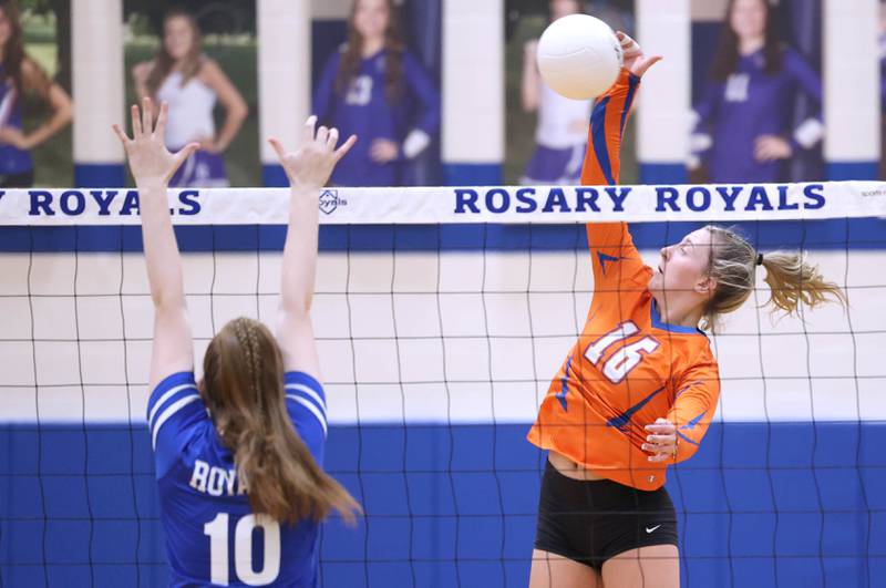 Genoa-Kingston's Alayna Pierce spikes the ball during their Regional semifinal match against Rosary Tuesday, Oct. 25, 2022, at Rosary High School in Aurora