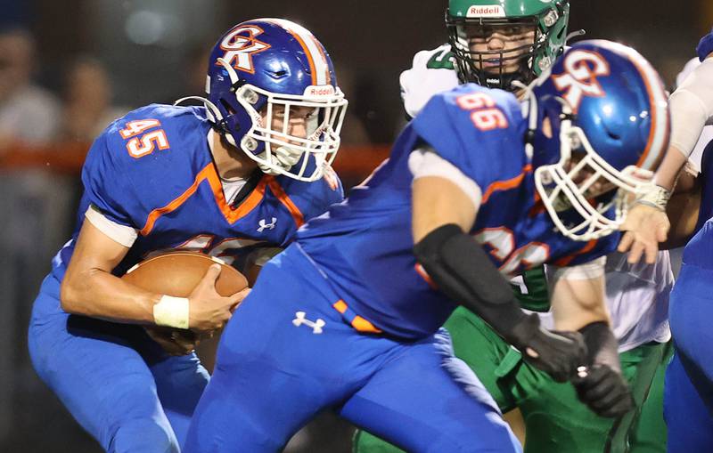 Genoa-Kingston's Maddox Lavender carries the ball behind his offensive line during their game against North Boone Friday, Sept. 9, 2022, at Genoa-Kingston High School.