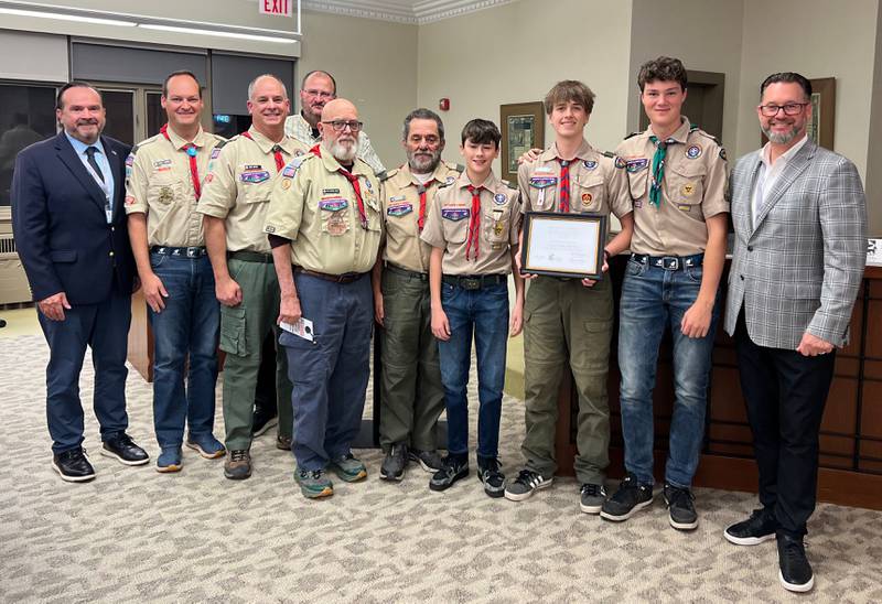Scout Troop 13 was awarded with a "Spirit of St. Charles Award" at the Nov. 3 city council meeting. Pictured, Alderman Ed Bessner (left), Troop 13, and Alderman Steve Weber (right).