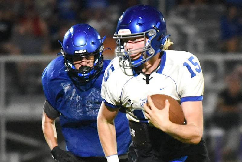 Central's Brady Shule, right, is chased down by Peotone's Omero Isais during a scrimmage at Manteno Thursday, July 24, 2025.