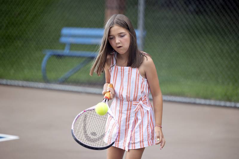 Lila Reuter, 8, plays a solo game of tennis Friday, July 25, 2025, during a family fun day at the end of the Emma Hubbs Tennis Classic.