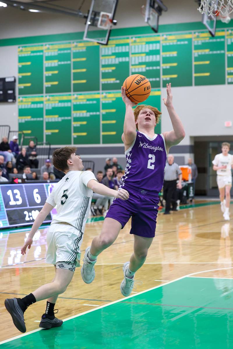 Wilmington's Travis Van Duyne goes for a layup against Bishop McNamara's Jayson Benton during Bishop McNamara's 61-24 victory over Wilmington in the IHSA Class 2A Seneca Sectional semifinal on Tuesday, March 3, 2026.