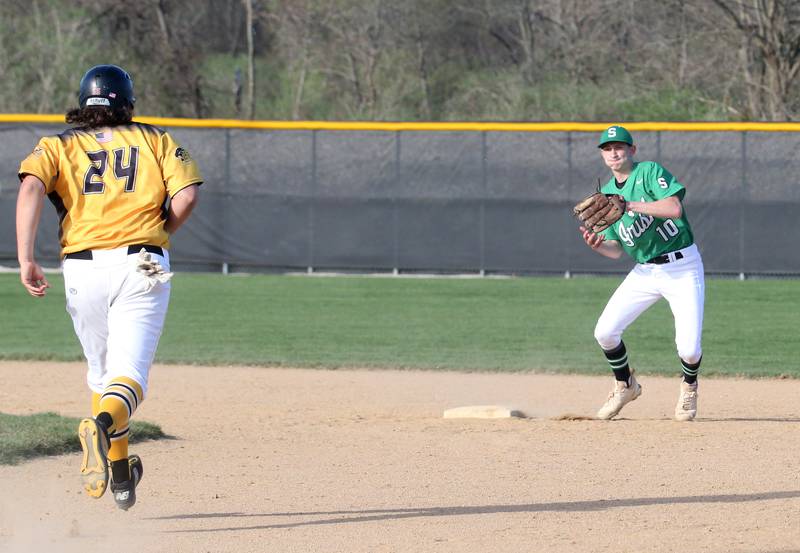 Seneca's Calvin Maierhofer steps on second base to force out Putnam County's Josh Jessen on Thursday, April 13, 2023 at Seneca High School.