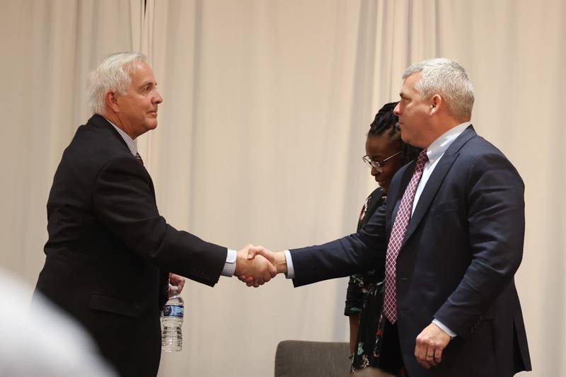 Mayor candidate Terry D’Arcy and Mayor Bob O’Dekirk shake hands at the conclusion of the Joliet Mayoral Candidate Panel luncheon hosted by the Joliet Region Chamber of Commerce on Wednesday, March 8th, 2023 at the Clarion Hotel & Convention Center Joliet.