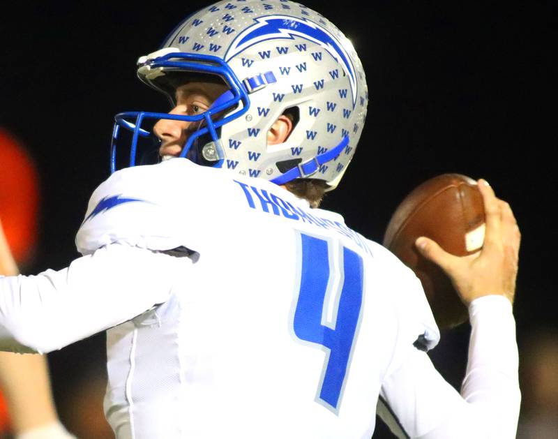 Woodstock’s quarterback Caden Thompson looks for an option  in varsity football at Woodstock North High School on Friday, October 24, 2025.