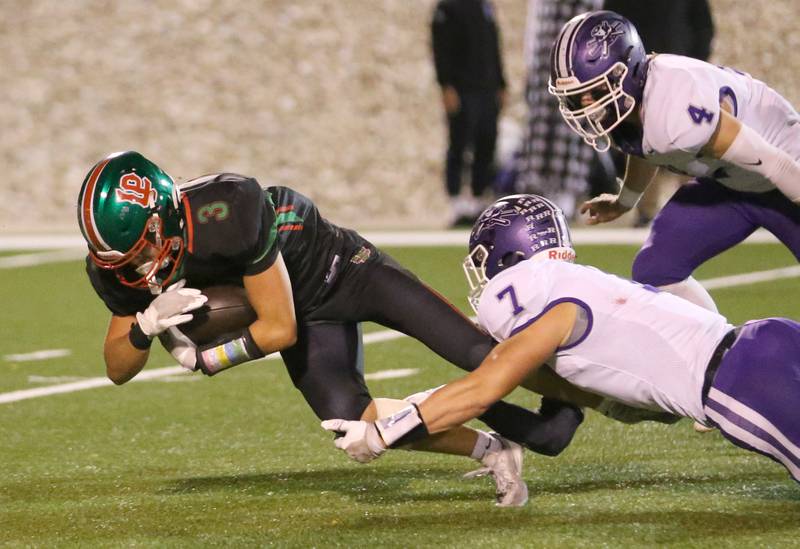 L-P's Michael Hartman dives for a few extra yards against Rochelle's Ethan Goodwin and teammate Gavin Neale on Friday, Sept. 27, 2024 at Howard Fellows Stadium.