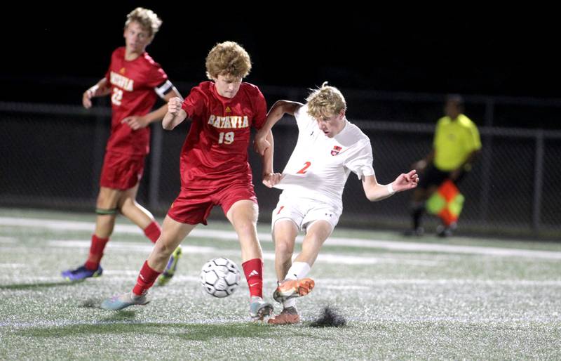 Batavia’s John Smeraglinolo (left) battles Oswego’s Alan Mindock (right) for the ball during a game at Batavia on Thursday, Sept. 7, 2023.