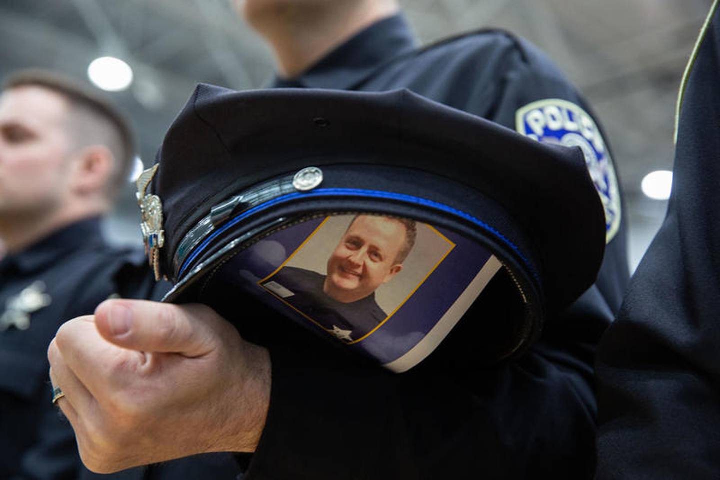 A program is tucked inside an officer's hat. Funeral services for McHenry County Deputy Sheriff Jacob Keltner is held at Woodstock North High School on Wednesday, March 13, 2019.