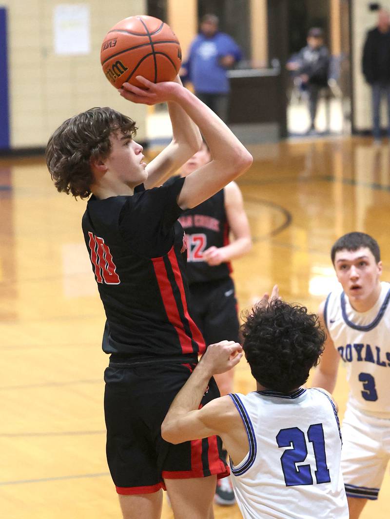 Indian Creek's Logan Schrader shoots over Hinckley-Big Rock's Josh Badal during their game Tuesday, Jan. 31, 2023, in the Little 10 Conference Basketball Tournament at Somonauk High School.