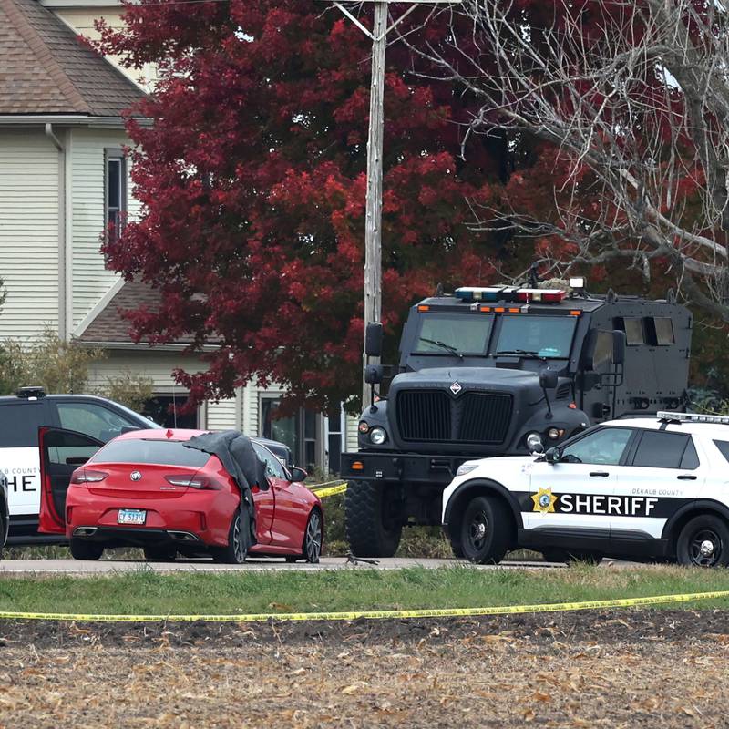 The vehicles involved in fatal police shooting remain in place Wednesday, Oct. 23, 2024, on Rich Road just west of Nelson Road in DeKalb Township as DeKalb County sheriff's deputies and law enforcement authorities continue to investigate. A man was shot and killed by police after an hours-long standoff involving a hostage. The man allegedly fired multiple rounds at officers, who returned fire, authorities said.