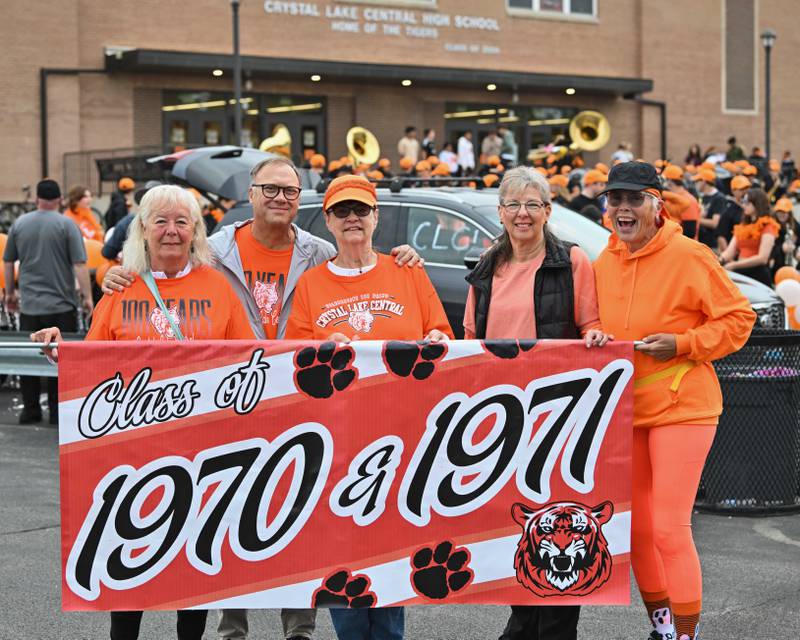 Crystal Lake Central H.S. class of '70-'71 from left, Sue McKinnon, Dave Gervais, Pam Thurow, Barb Predrich, and Diane Freutel, take their place in line for CLC's 100th anniversary homecoming day parade on a rainy Saturday, Sep. 16, 2023 in Crystal Lake. The parade began at the high school and made its way through downtown Crystal Lake.