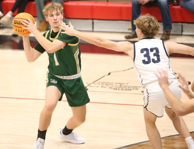 St. Bede's Kaden Newman looks to pass the ball around Ridgeview's Max Mason during the Route 17 Classic Tournament on Wednesday, Nov. 27, 2024 at Woodland High School.