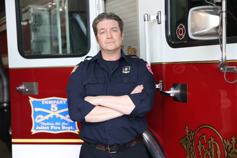 Joliet Firefighter Chris “coach” Kinsella poses for a photo on Thursday, April 11. Kinsella is the defensive line coach for Joliet Catholic’s football which earned him the nickname “coach” at the station.